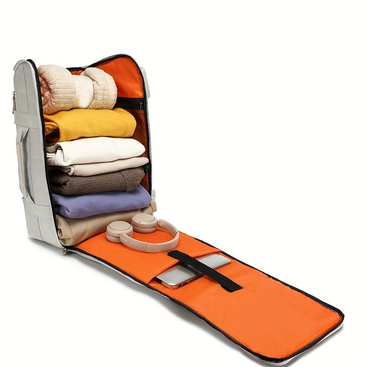Silvergrå stor ryggsäck öppen med orange insida, laptopfack och packade kläder.