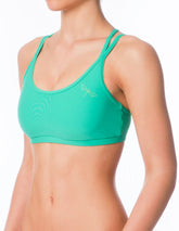 Turkos sport-bh med dubbla axelband och smal resår under bysten, ergonomisk passform.
