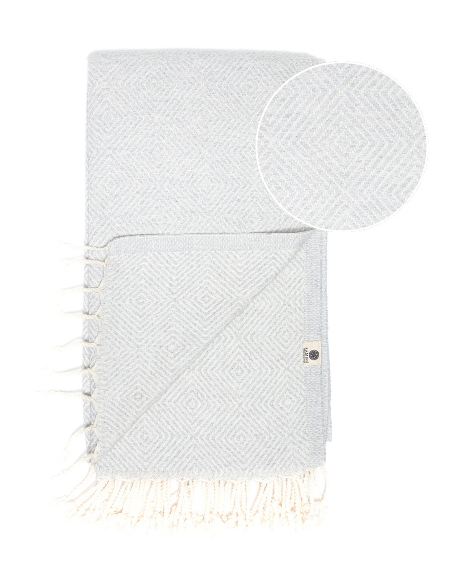 Grå turkisk hammam strandhandduk i bomull med mönster och fransar i båda ändar.
