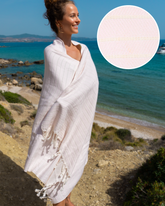 Ljusrosa turkisk hammamhandduk i bomull och bambu med fransar, lätt och kompakt.