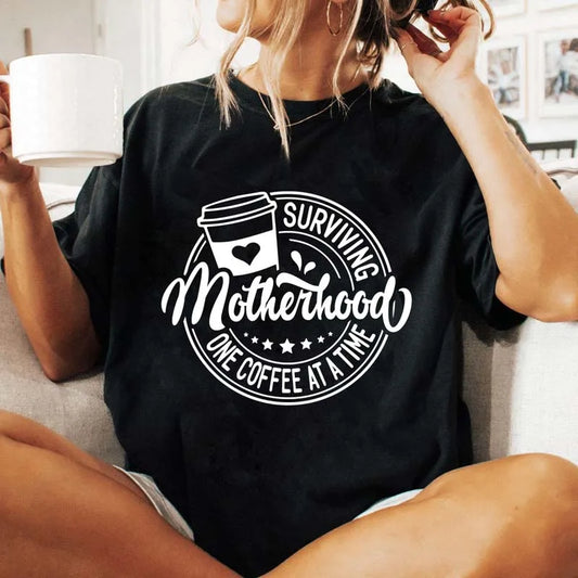 เสื้อยืด Surviving Motherhood One Coffee at a Time